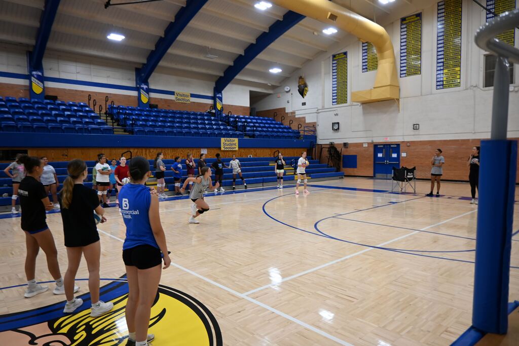 Girls volley the ball learning control.