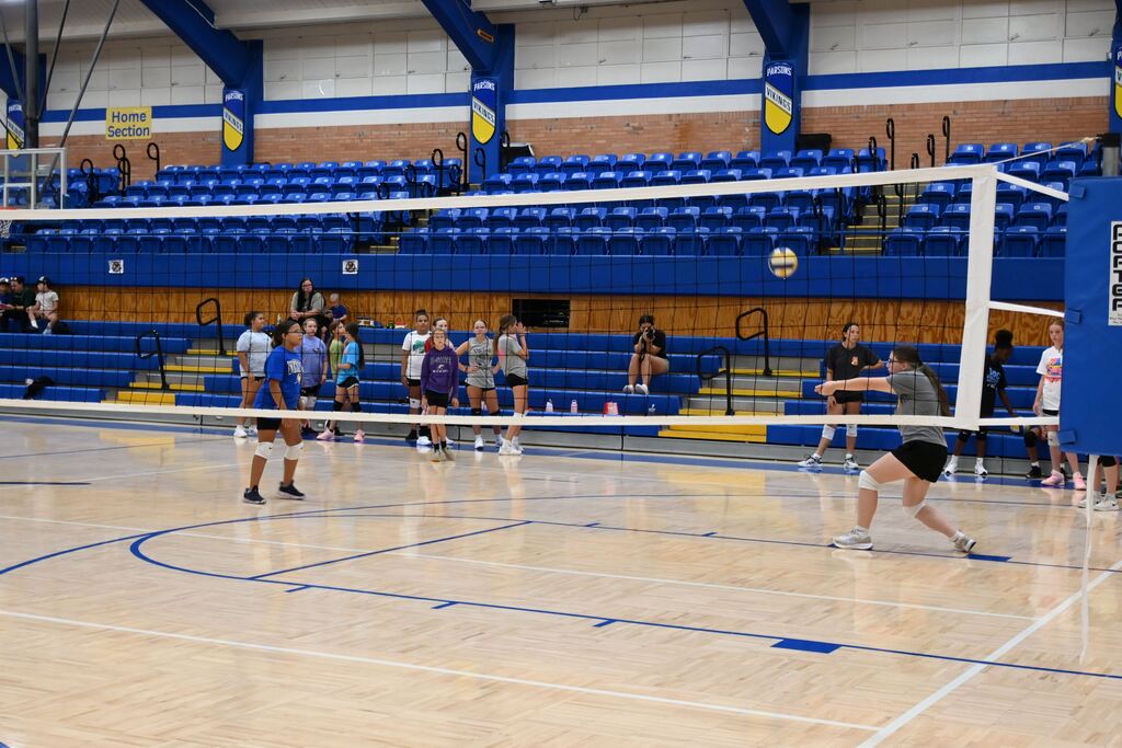 Girls volley the ball learning control.