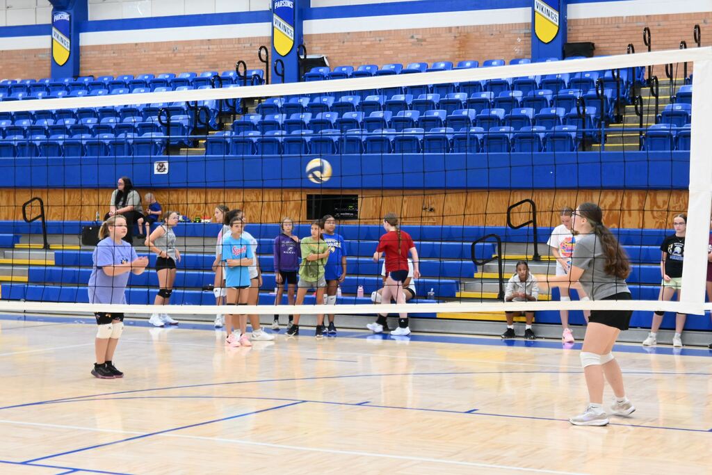 Girls volley the ball learning control.