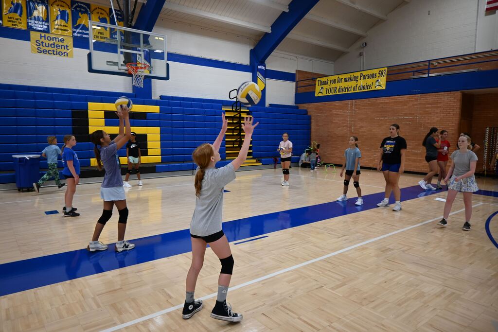 Girls volley the ball learning control.