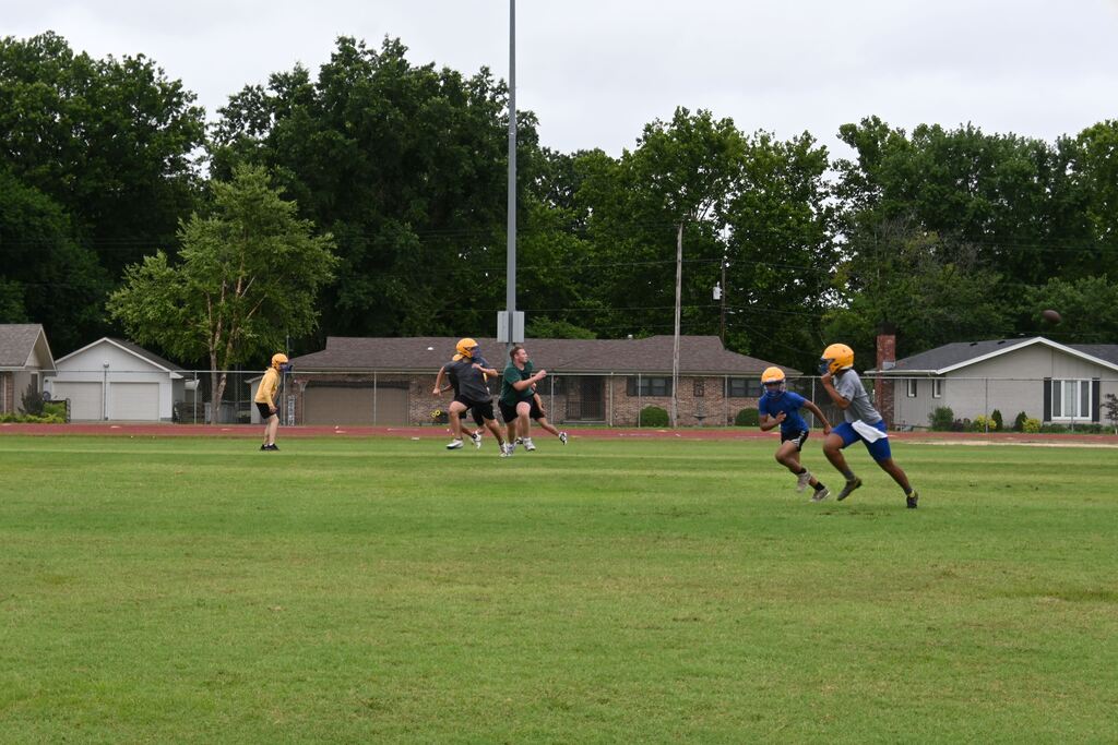 Boys practicing football.