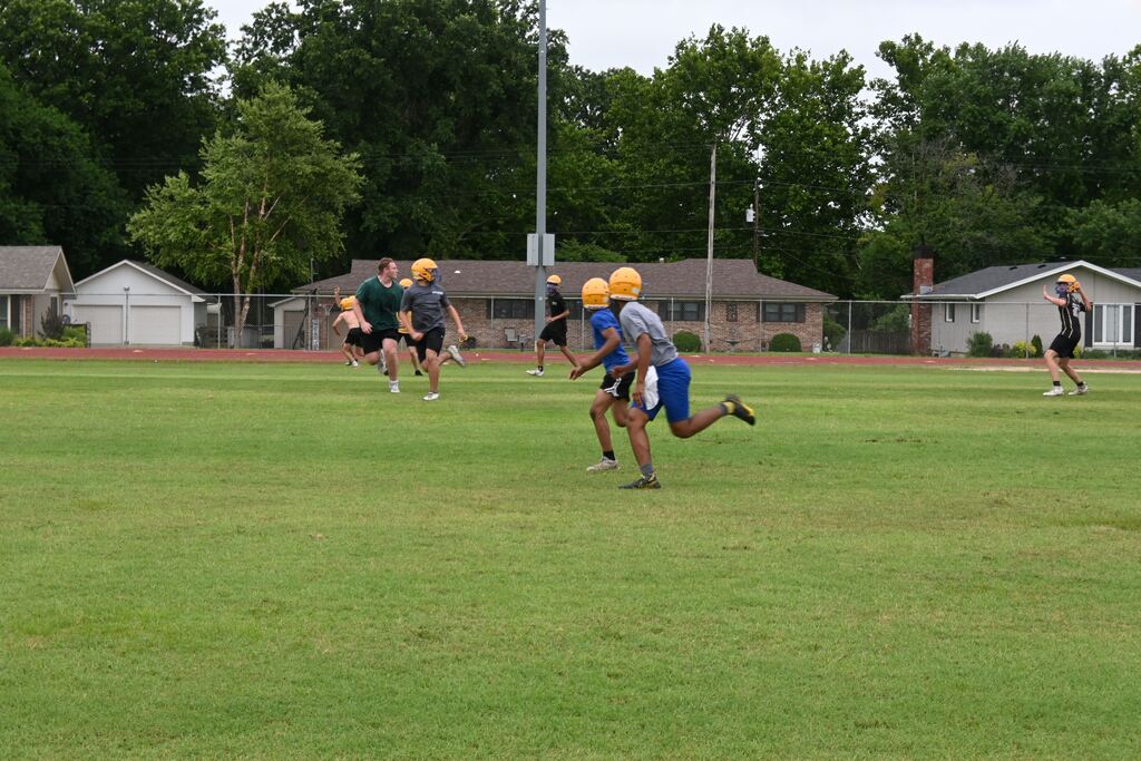 Boys practicing football.