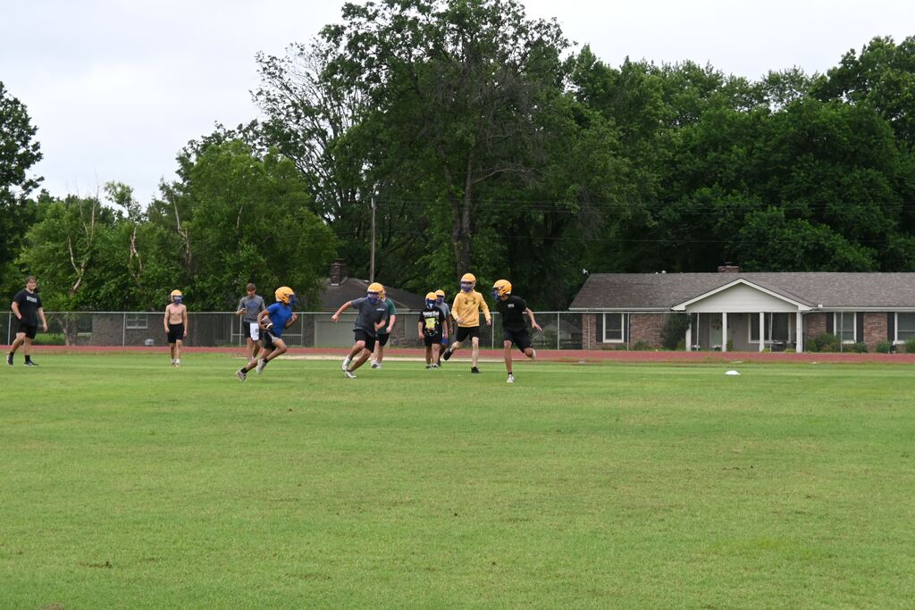 Boys practicing football.