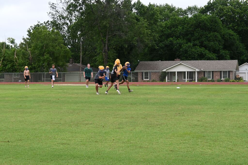 Boys practicing football.