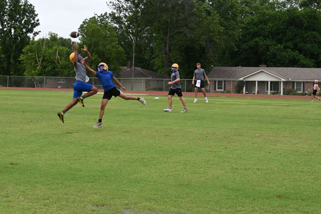 Boys practicing football.