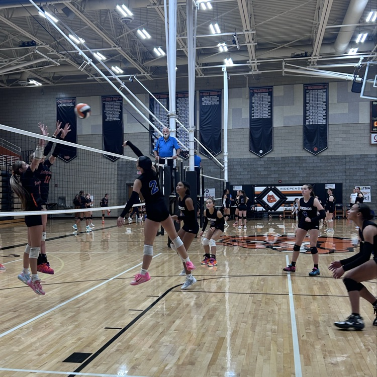 Brynna spiking on front row 