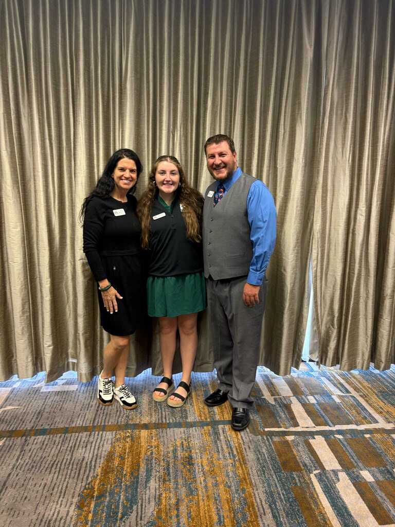 Maddy Boss with KFTA representatives, Amy Hillman and Todd Roberts