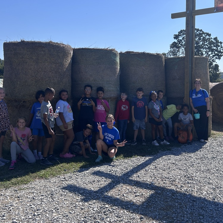 posing in front of the hay maze as a class 
