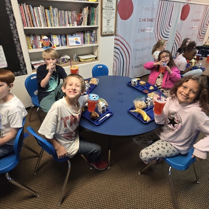 boys and girls showing off their teas