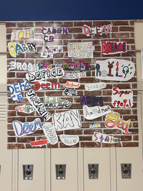 Students created a faux graffiti wall.