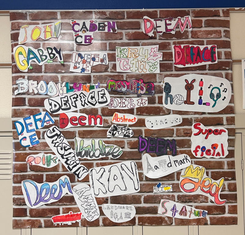 Students creted a faux graffiti wall for fun, capping off their argumentative writing  assignment.