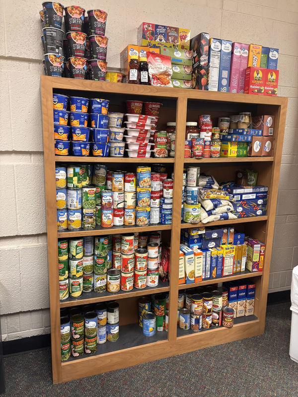A shelf in the Viking Food Bank is filled with food ready for students.