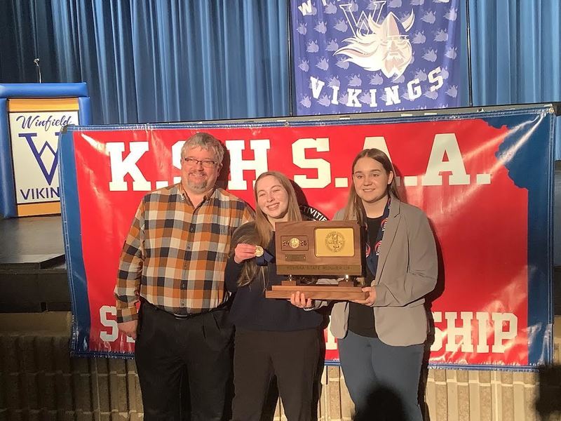 Ed Workman at the state competition with two winning students.