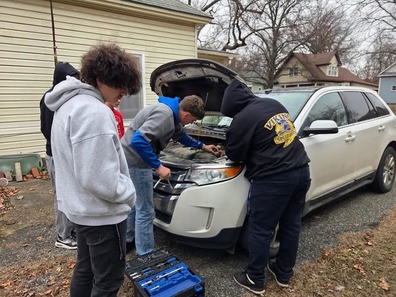 Students took a field trip to work on a car.