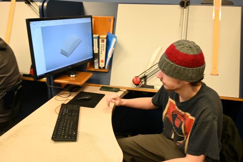 Jack shows the lens cover CAD drawing he made to 3D print a prototype lens cover.