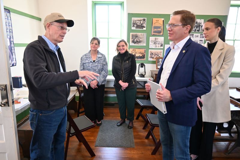 Pruitt talks to Toland as Perkins and Clarkson listen.