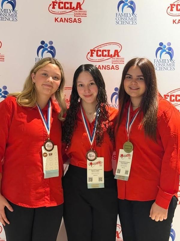 The three students placing third.