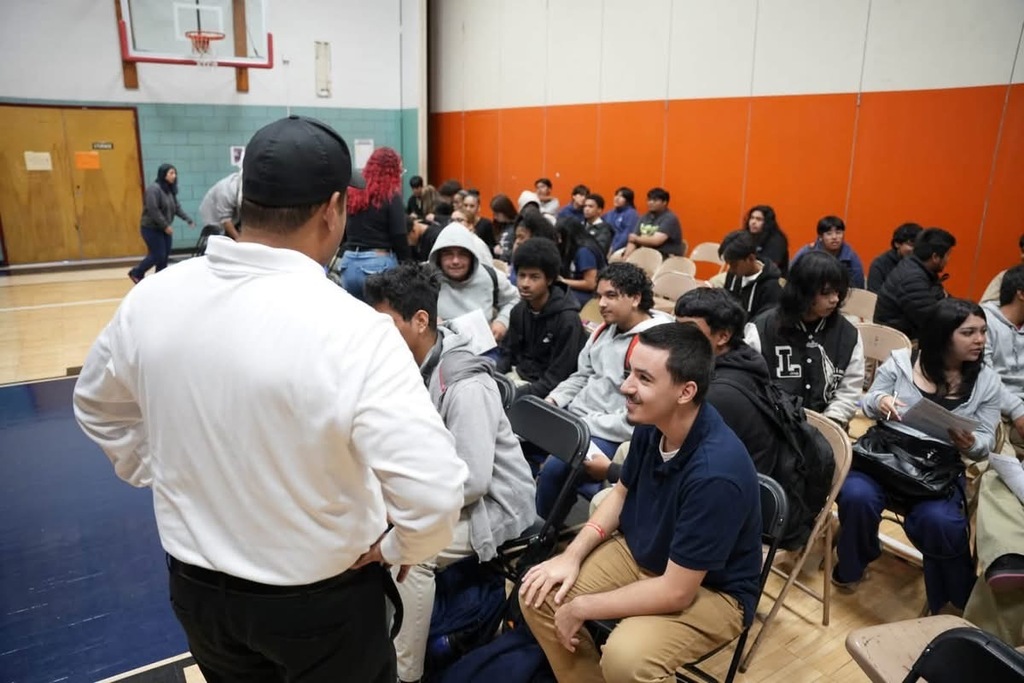 Students actively engaged in the presentation with Mr. Lora 