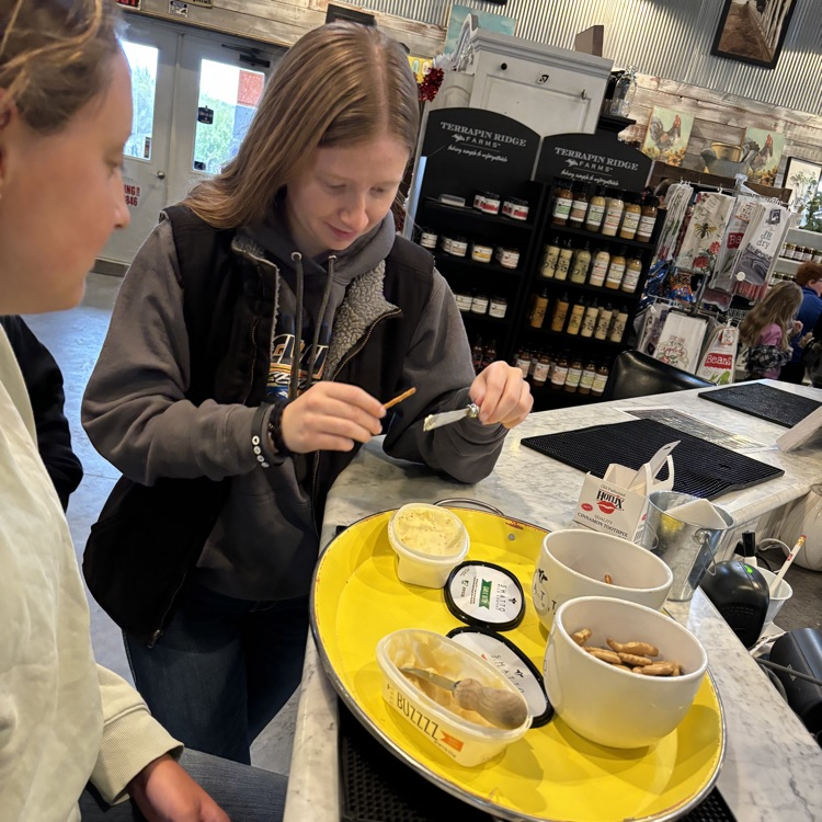 Girls tasting butter samples