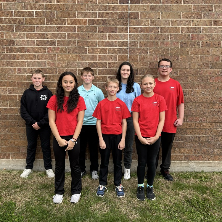 6 kids against a brick wall