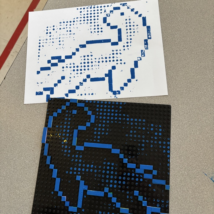 Transferring image from printing plate to paper.