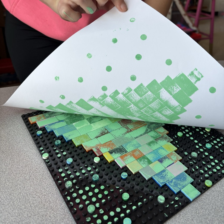 Transferring image from printing plate to paper.