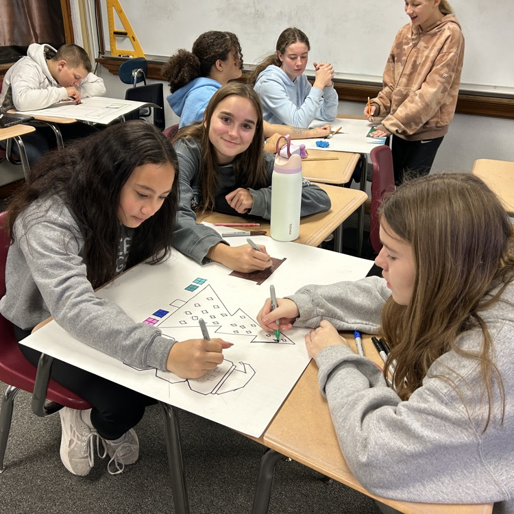 students working in desks 