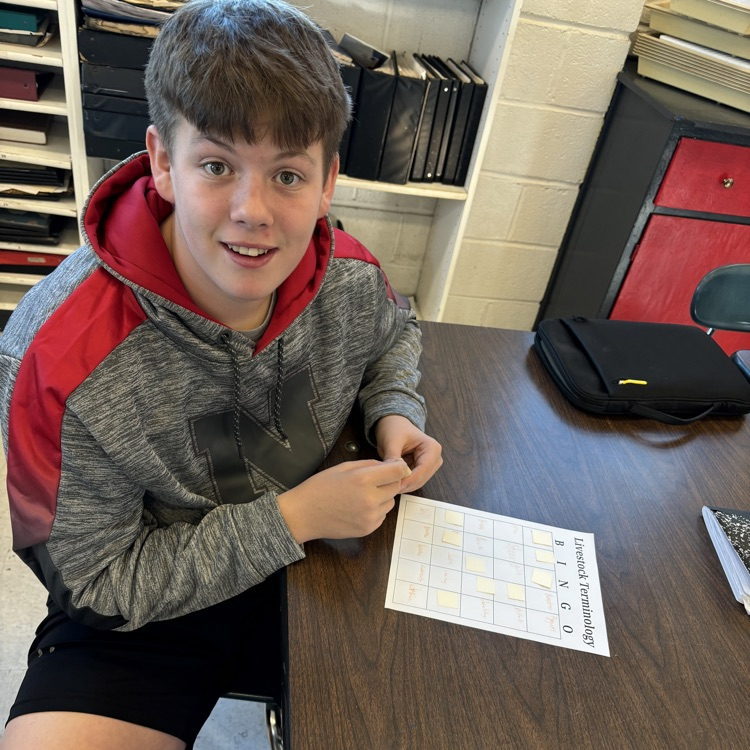 one boy smiling at the camera