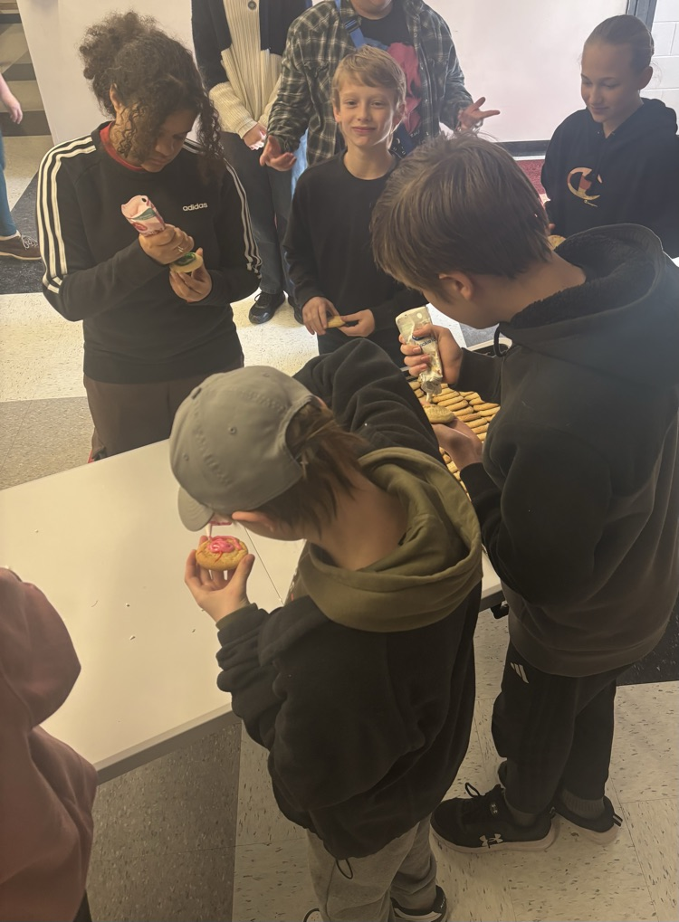 students decorating cookies 
