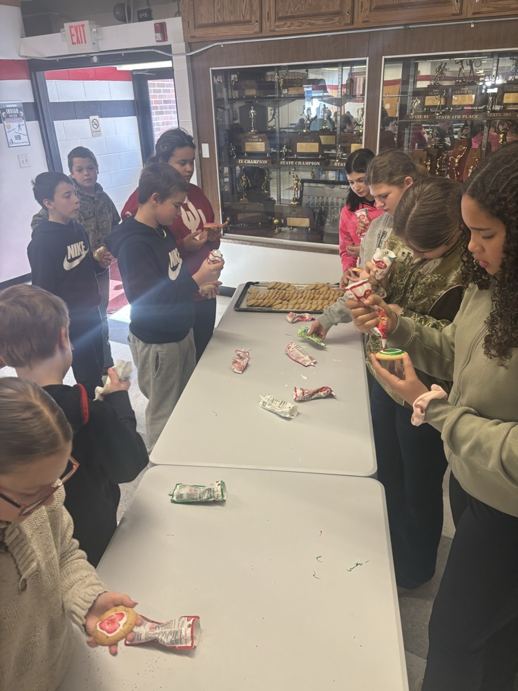 students decorating cookies 