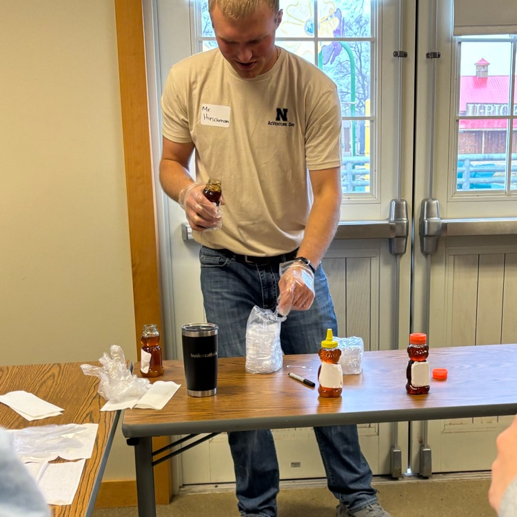 workshop leader with different types of honey