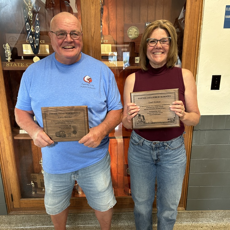 man and woman with plaques