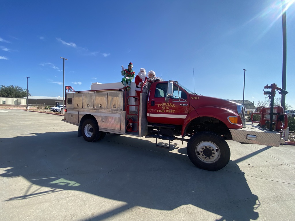 Mr and Mrs. Claus and their Elf stopped by