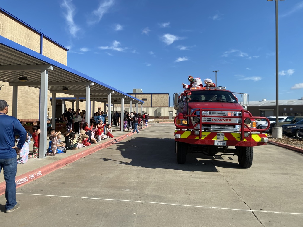 Mr and Mrs. Claus and their Elf stopped by