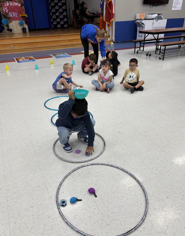 During group with Ms. Kristin, Pre-K students engaged in exercises that stimulated the vagus nerve, encouraged crossing the body’s midline, activated the core, and required focused attention to support emotional regulation.