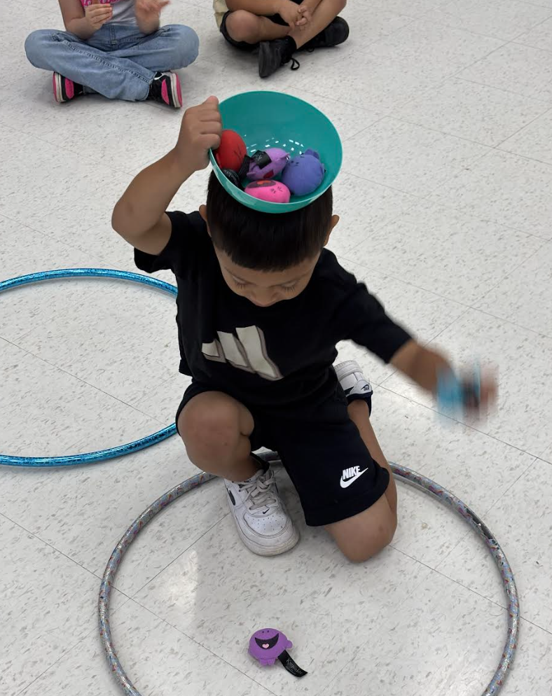 During group with Ms. Kristin, Pre-K students engaged in exercises that stimulated the vagus nerve, encouraged crossing the body’s midline, activated the core, and required focused attention to support emotional regulation.