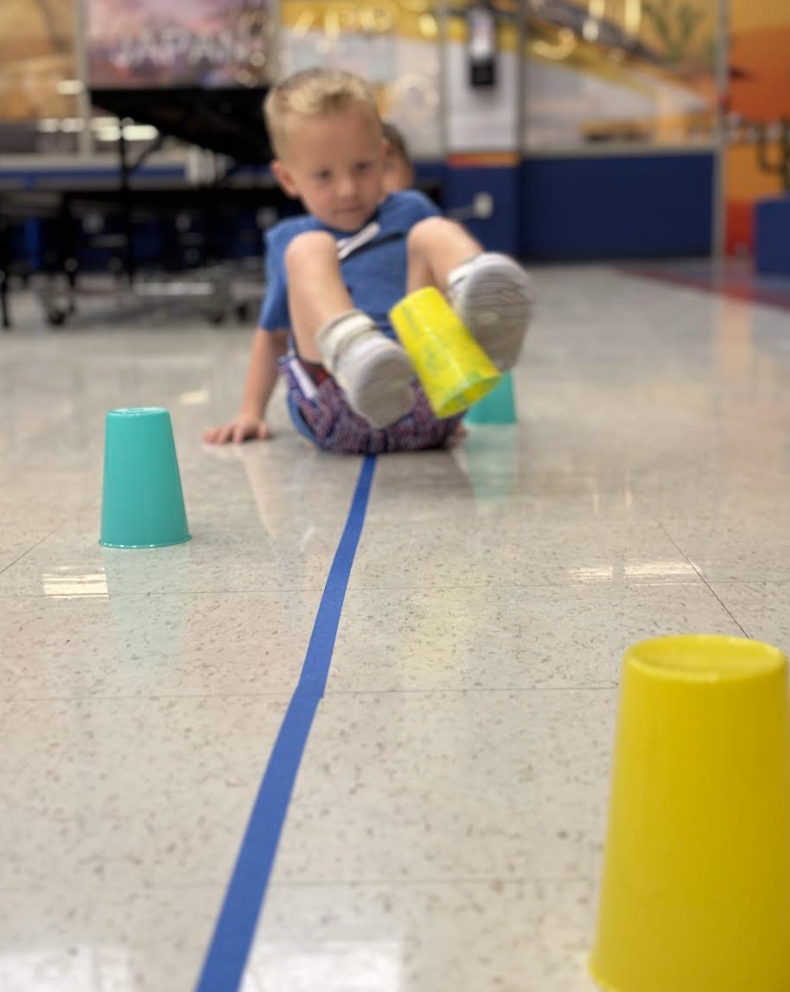 During group with Ms. Kristin, Pre-K students engaged in exercises that stimulated the vagus nerve, encouraged crossing the body’s midline, activated the core, and required focused attention to support emotional regulation.
