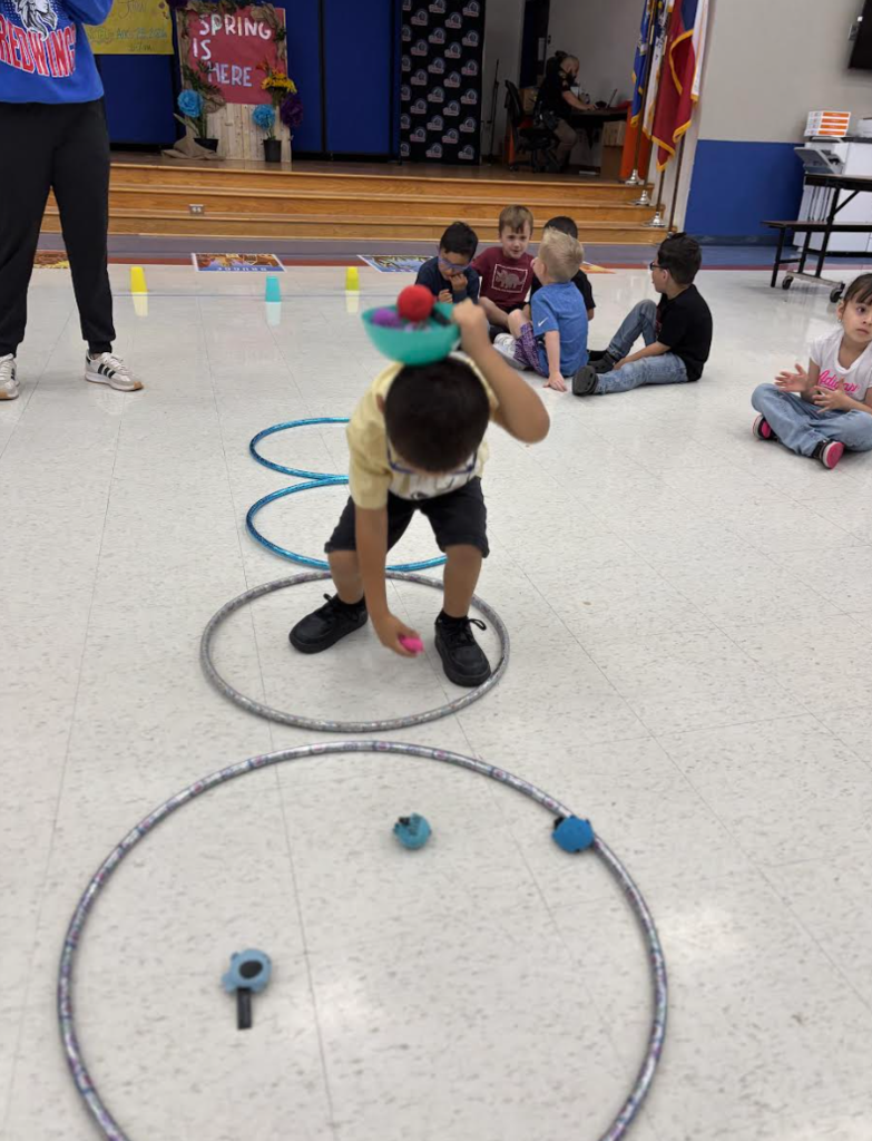 During group with Ms. Kristin, Pre-K students engaged in exercises that stimulated the vagus nerve, encouraged crossing the body’s midline, activated the core, and required focused attention to support emotional regulation.