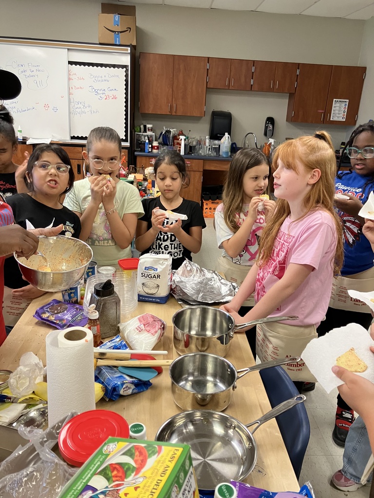 Second graders enjoying a taste test of fresh basil, squash, and spaghetti squash that they planted and harvested. Thank you Ms. Latin for teaching us how to grow nutritious food and a special thank you for the work aprons.