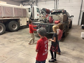 Looking at the small truck.