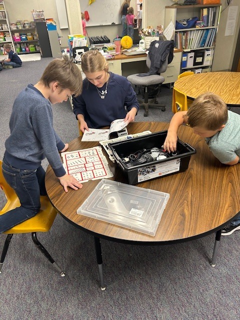 Sawyer came to help Qaletaqa and Clyde work on a robot. 