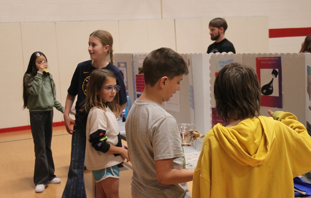 The fifth graders showing their projects.