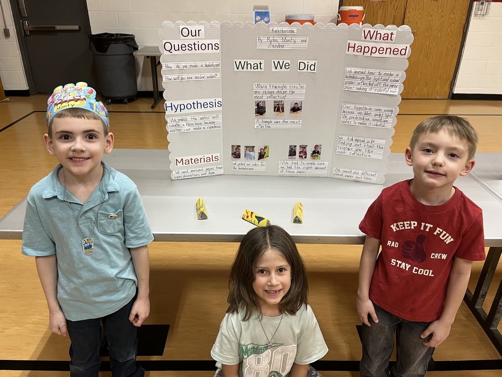 The first and second graders showing off their first place project. 