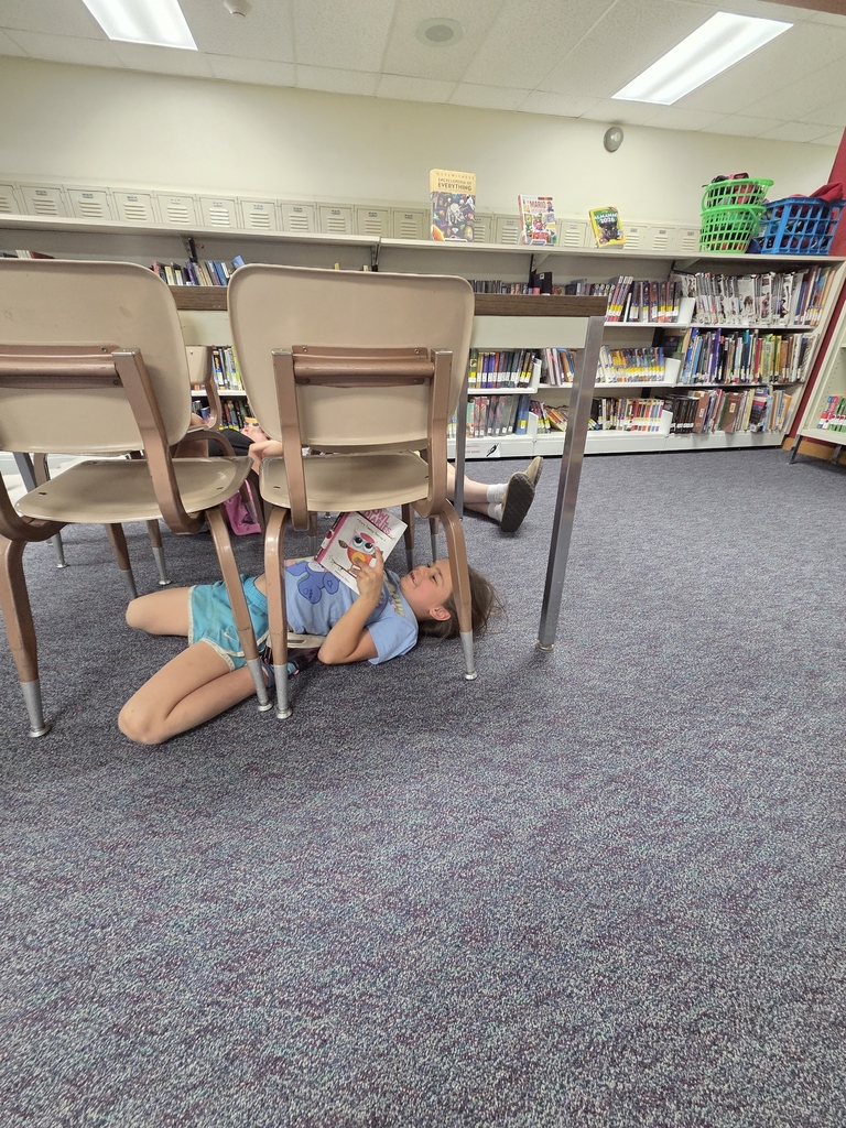 Onyxx reading in the library.