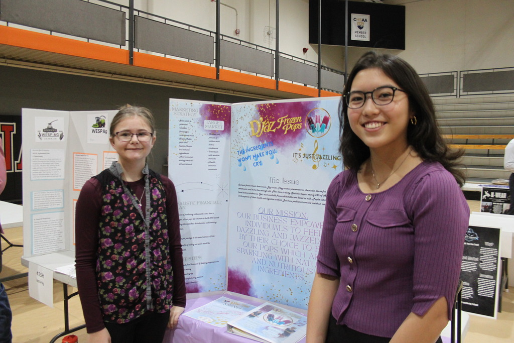 Jadyn and Aya at their booth