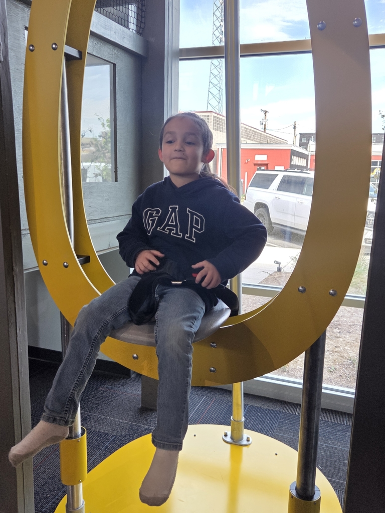 Noah riding on the chair..