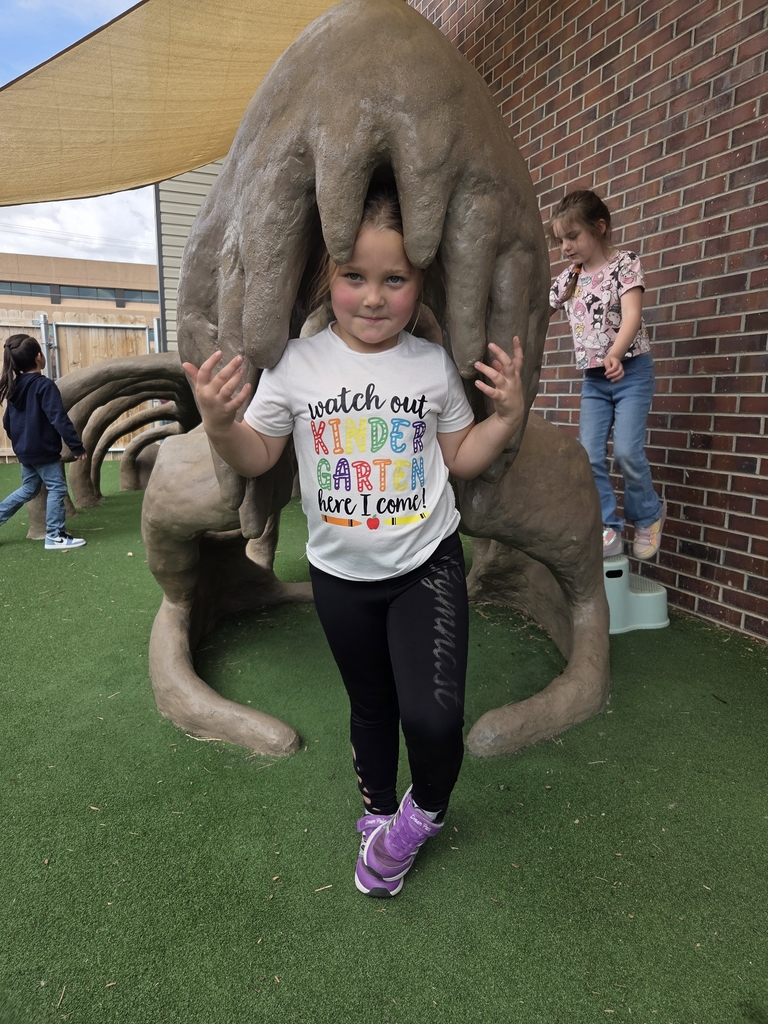 Claire under dinosaur. 
