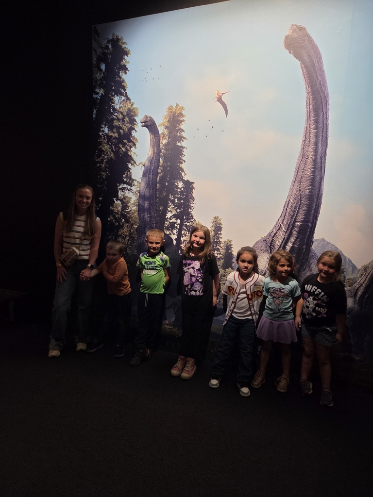 Students in dinosaur exhibit. 