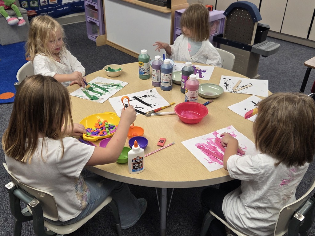 The students are painting and sorting beans.