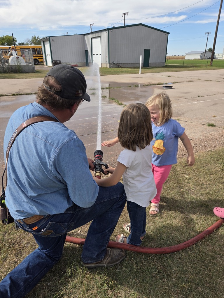 Students spraying water.